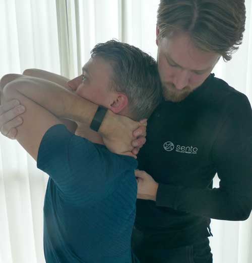 a man holding another man's head